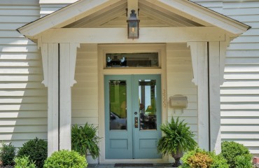 07_custom_covered_front_porch_bluestone_patio_front_view.JPG